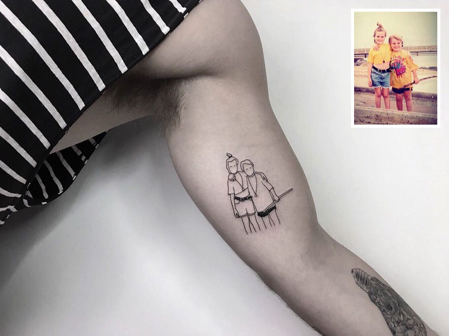 Tattoo of childhood picture on arm, inspired by nostalgic photos, showing two kids on the beach.