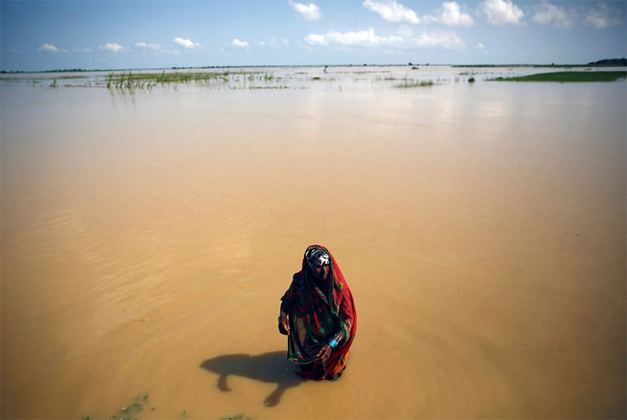 A Flood Victim Washes Herself In Saptari District, Nepal
