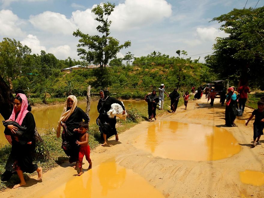 Rohingya People Run To Enter Into Bangladesh From A Makeshift Shelter Near The Bangladesh-myanmar Border, After A Gunshot Was Heard On The Myanmar Side