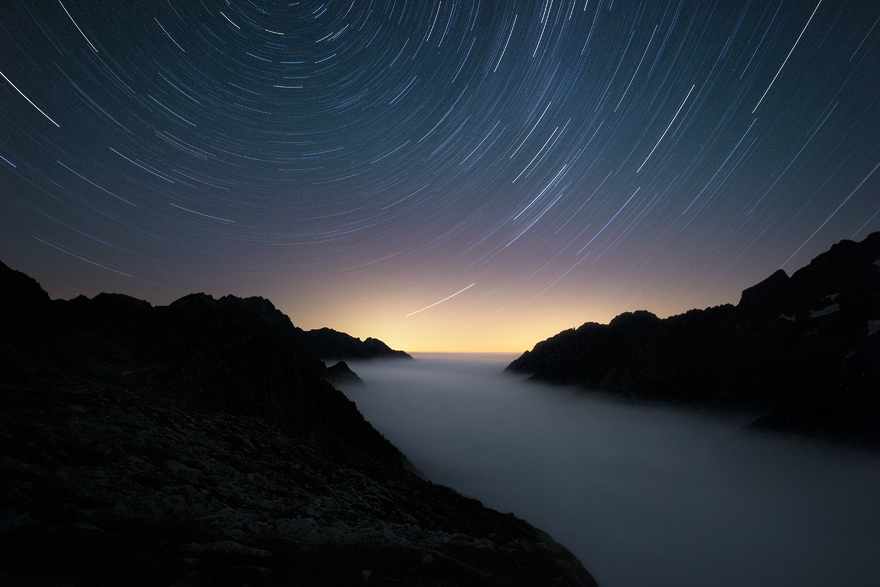 Startrails Above A Cloudscape