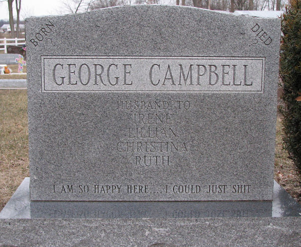 Humorous tombstone carved with George Campbell’s name and witty epitaph in a cemetery setting.
