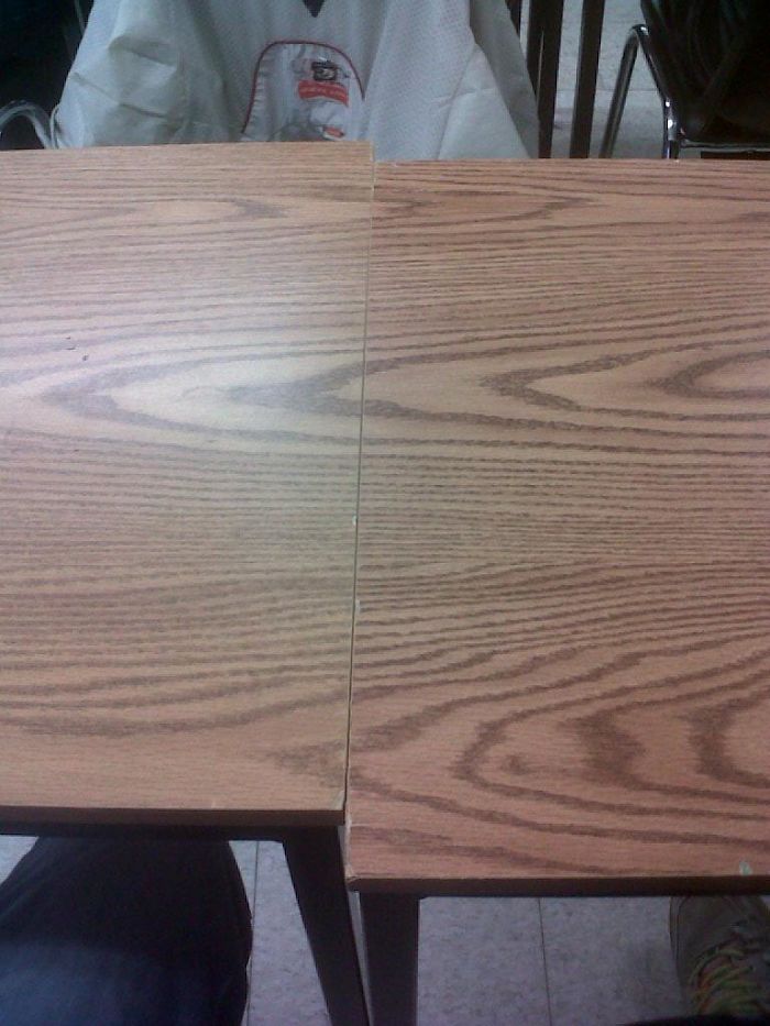 The Laminate Wood Lines Up On These Two Desks