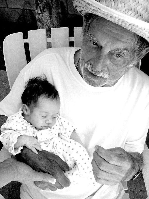 Passing The Torch. Great-Grandfather Meeting His Great-Granddaughter