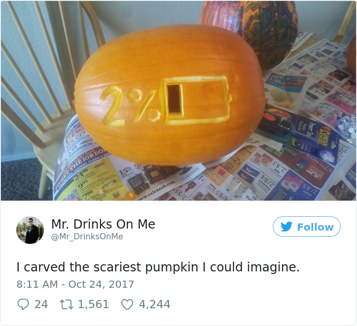 Scary carved pumpkin displaying a low battery symbol and 2% battery remaining.