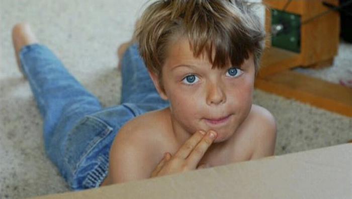 Corey Maison as a boy lying on the bed shirtless Corey Maison as a boy lying on the bed shirtless