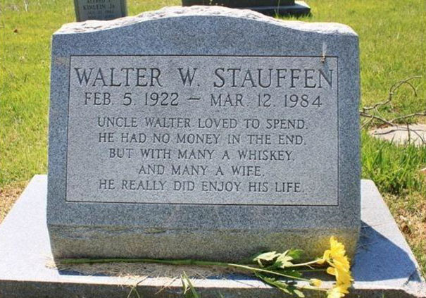 Tombstone with funny epitaph about enjoying life, whiskey, and wife, showcasing humor in tombstones.