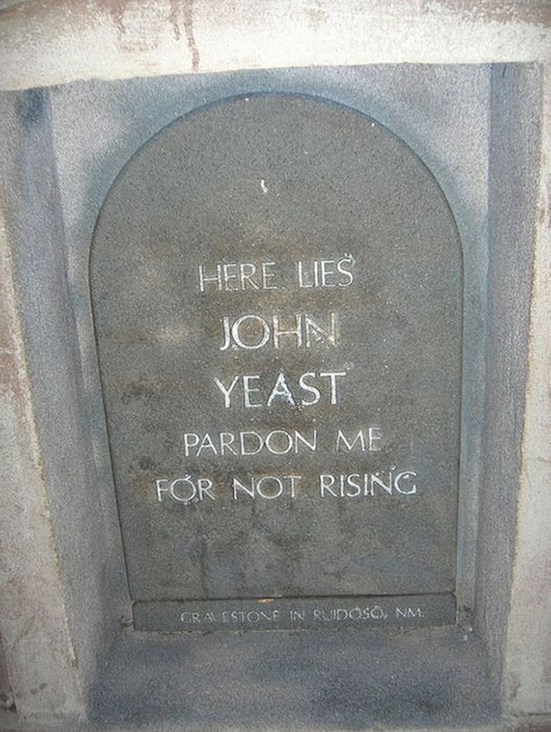 Funny tombstone inscription of John Yeast saying pardon me for not rising, showcasing undying humor on a gravestone.