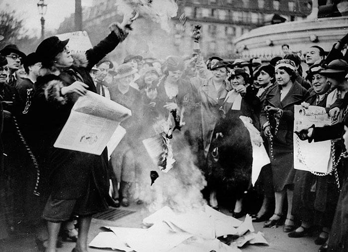 Feminists Are Burning Some Election Posters To Fight For Women's Suffrage. Photograph. Paris, France, 12 May 1935
