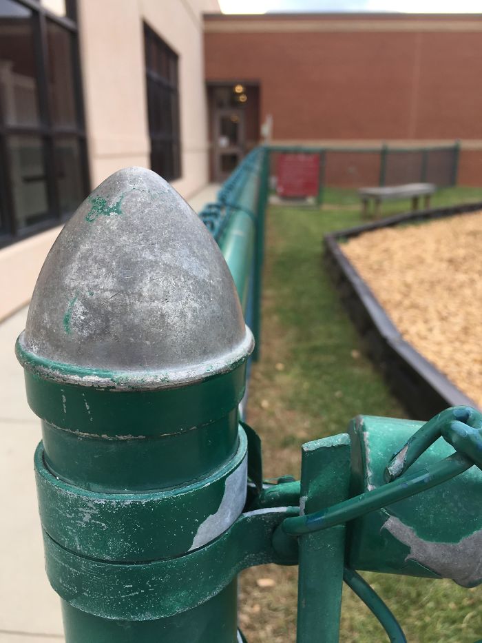 The Top Of This Fence Post Is Used By People To Swing Around A Corner