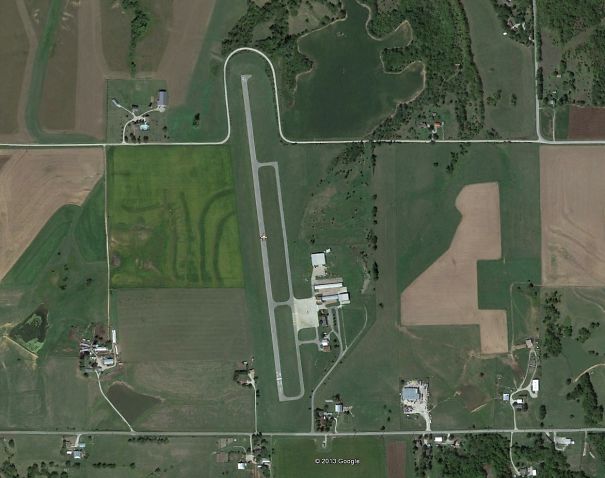 The Road Loops Around The Runway At Amelia Earheart Airport