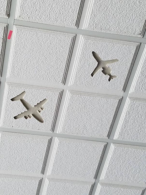 Airport's Ceiling Tiles Have Different Kinds Of Airplanes On Them