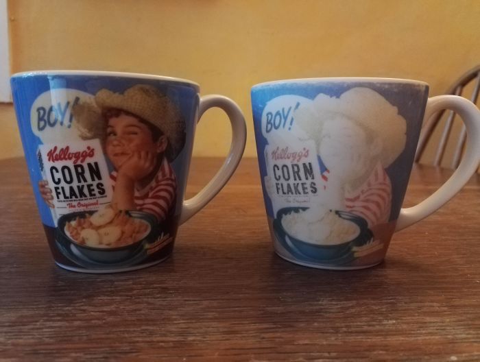 Identical 15 Year Old Mugs. Right Hand Mug Shows 15 Years Of Dishwasher Wear. Left Hand Mug Has Been Kept In Storage