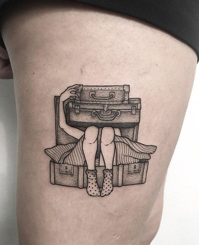 Tattoo of a suitcase with a person inside, symbolizing travel and adventure.