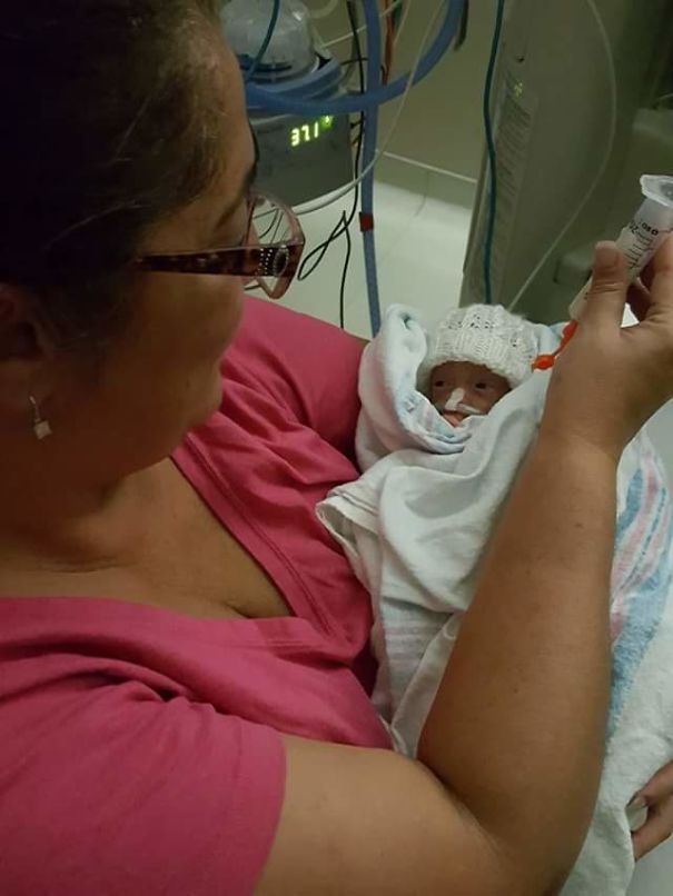 Nanna Holding And Feeding Quinton After Arriving At Less Than 24 Wks Gestation. Weighing In At Less Than 900 Grams. He Is Thriving And Doing Well, Just Started Walking, Has 3 Teeth And Talking.