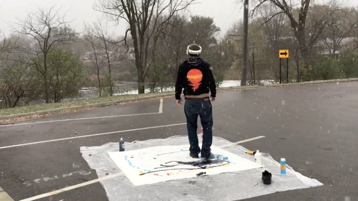 Artist Paints With His Feet While Viewing From An Overhead Drone With A Vr Helmet In A Snowstorm