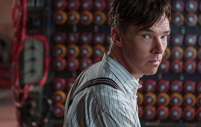 Scene from The Imitation Game movie featuring a focused man in vintage clothing, highlighting fun facts about movies.