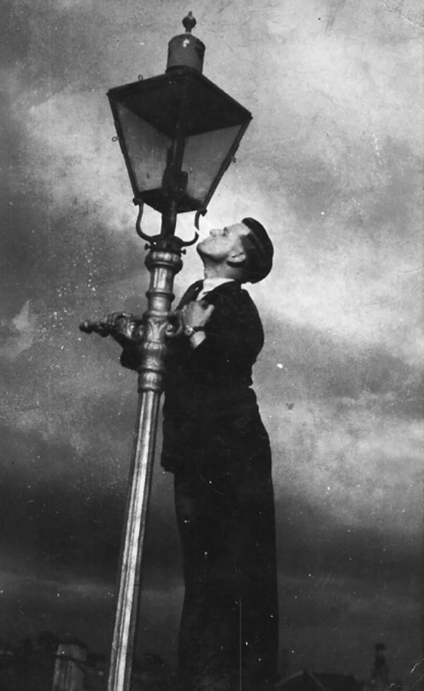 My Grandfather Lighting A Cigarette From A Street Lamp. What A Dude