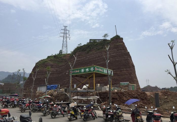This "Nail House" House Sits On A Mound Above Ground Level Because The Developer Dug Out The Land Around It