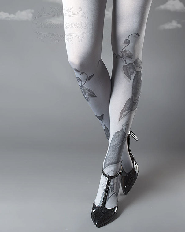 Tattoo socks with floral design, worn with black high heels on a gray background.