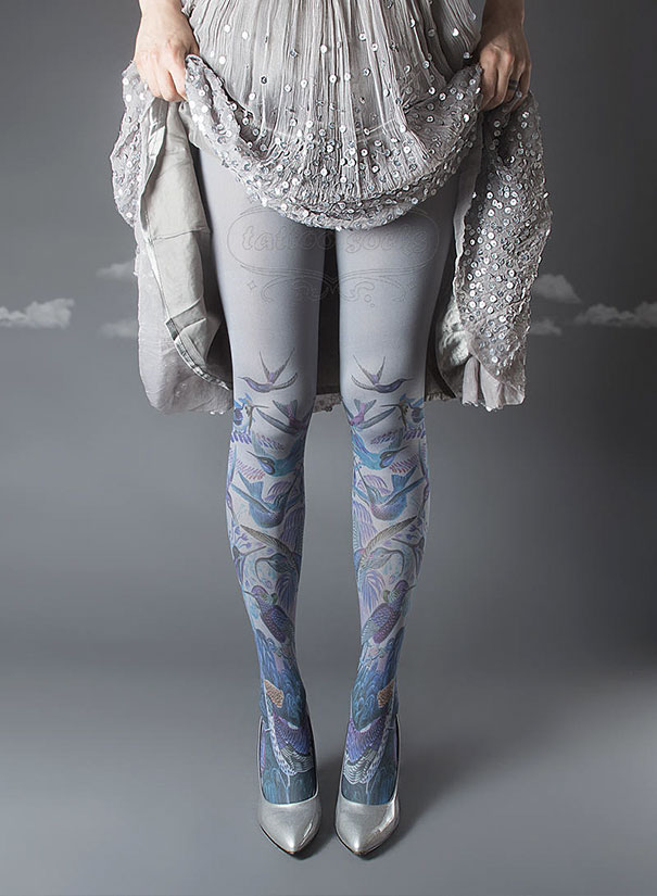 Woman wearing tattoo socks with intricate bird design and silver heels, holding a sequined dress.