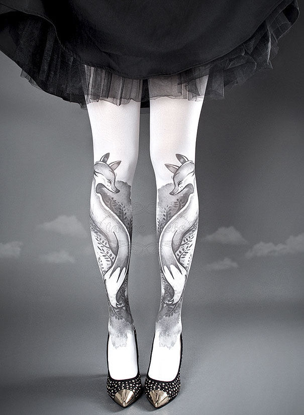 Tattoo socks featuring a fox design worn with black heels and a black skirt.