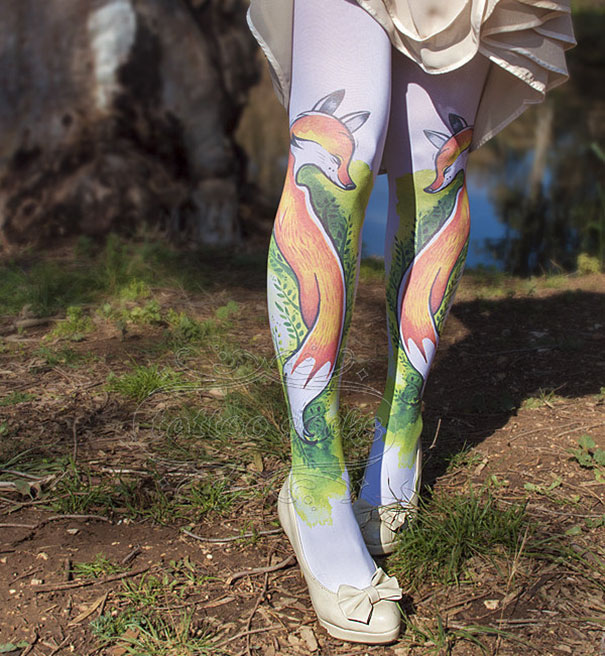 Tattoo socks with a colorful fox design worn in an outdoor setting.