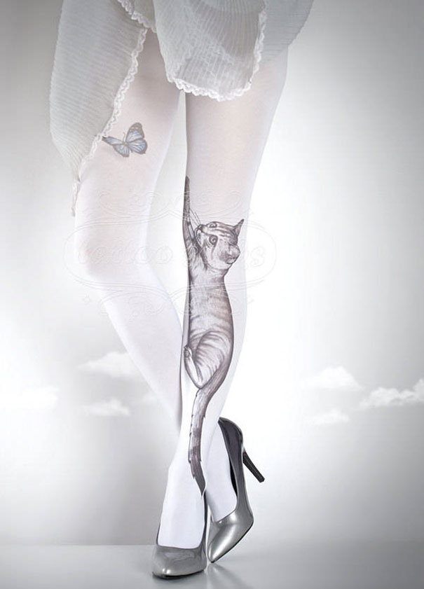 Tattoo socks with cat and butterfly design worn with silver heels.