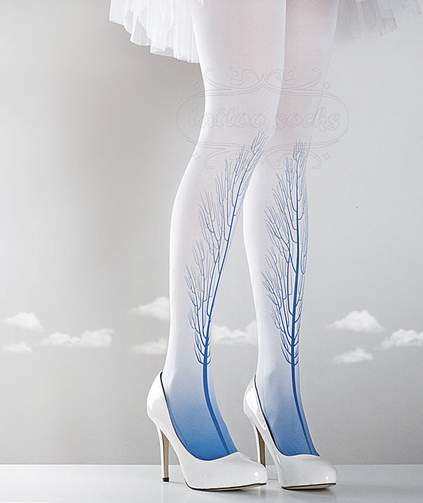 White high heels with tattoo socks featuring blue tree design against a soft background.