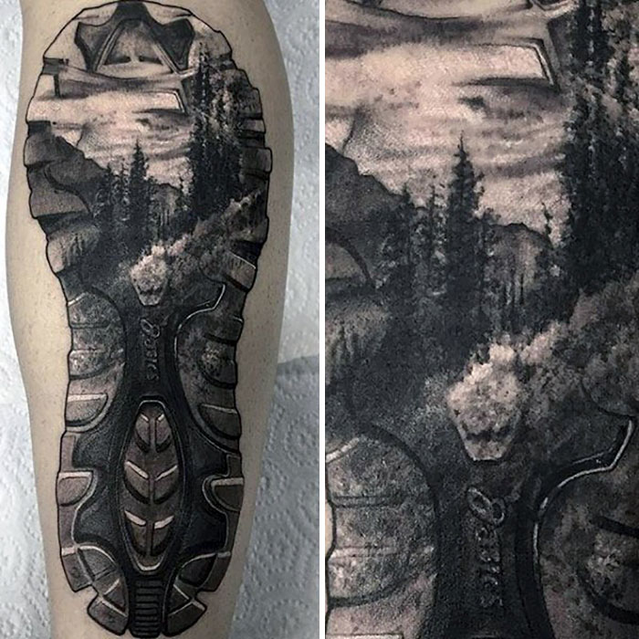 Travel tattoo featuring a scenic landscape in a footprint design on forearm.