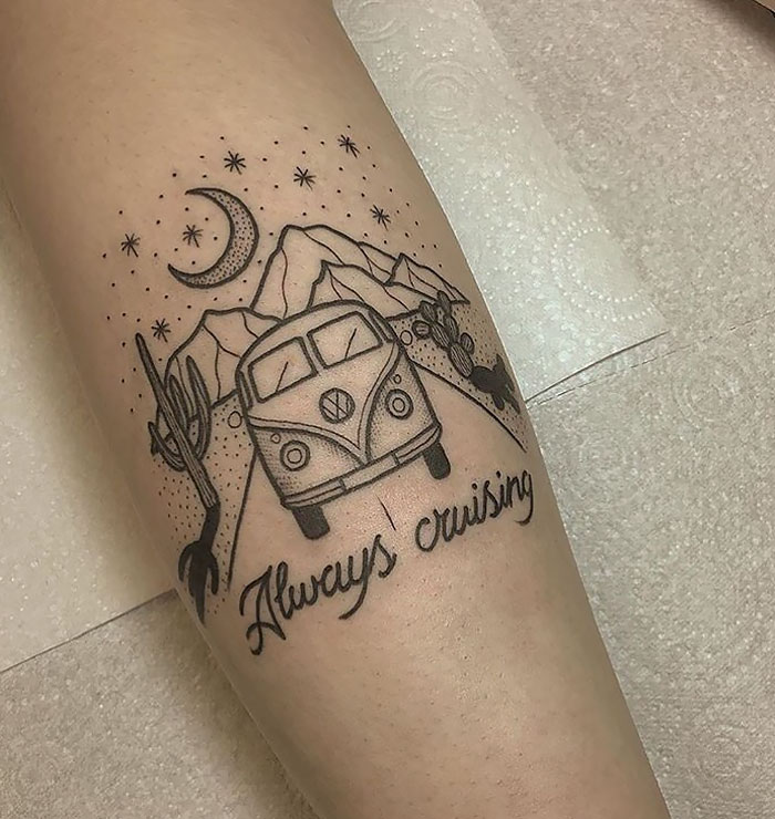 Tattoo of a van with mountains and stars, captioned "Always cruising," inspiring travel vibes.