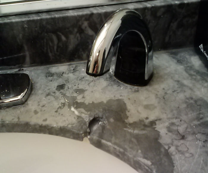 The Soap From This Dispenser Has Worn Away At This Stone Counter-Top