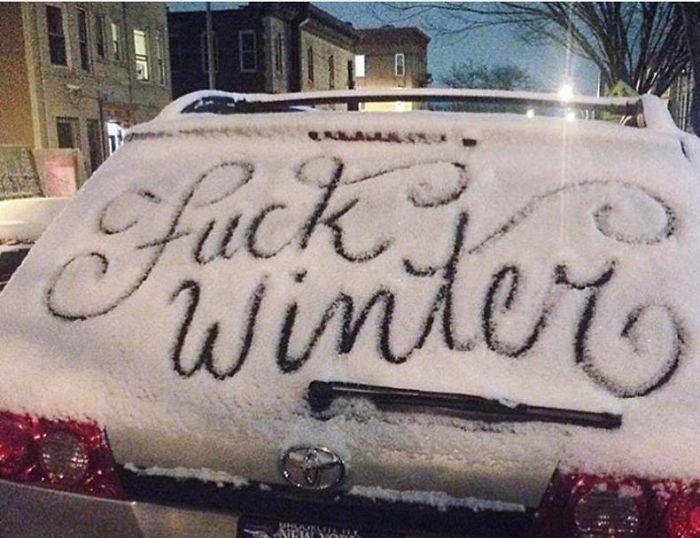 Beautiful handwriting in snow on a car window.