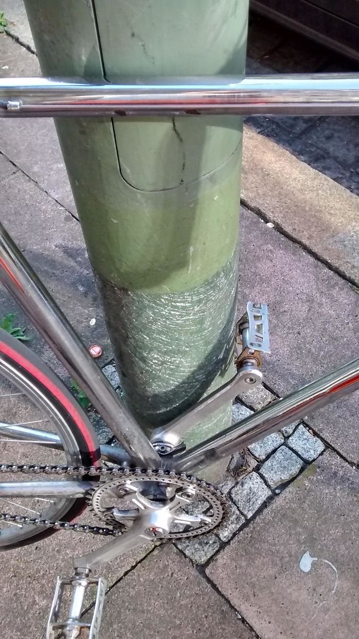 The Way This City Light Was Scratched By Bike Pedals Over The Years