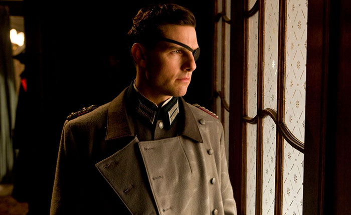 Scene from Valkyrie movie showing man in military uniform with eye patch looking out a decorative window, movie fun facts.
