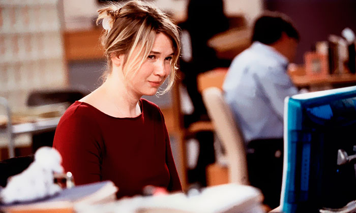 Scene from Bridget Jones's Diary movie featuring main character at a desk, illustrating fun facts about movies.