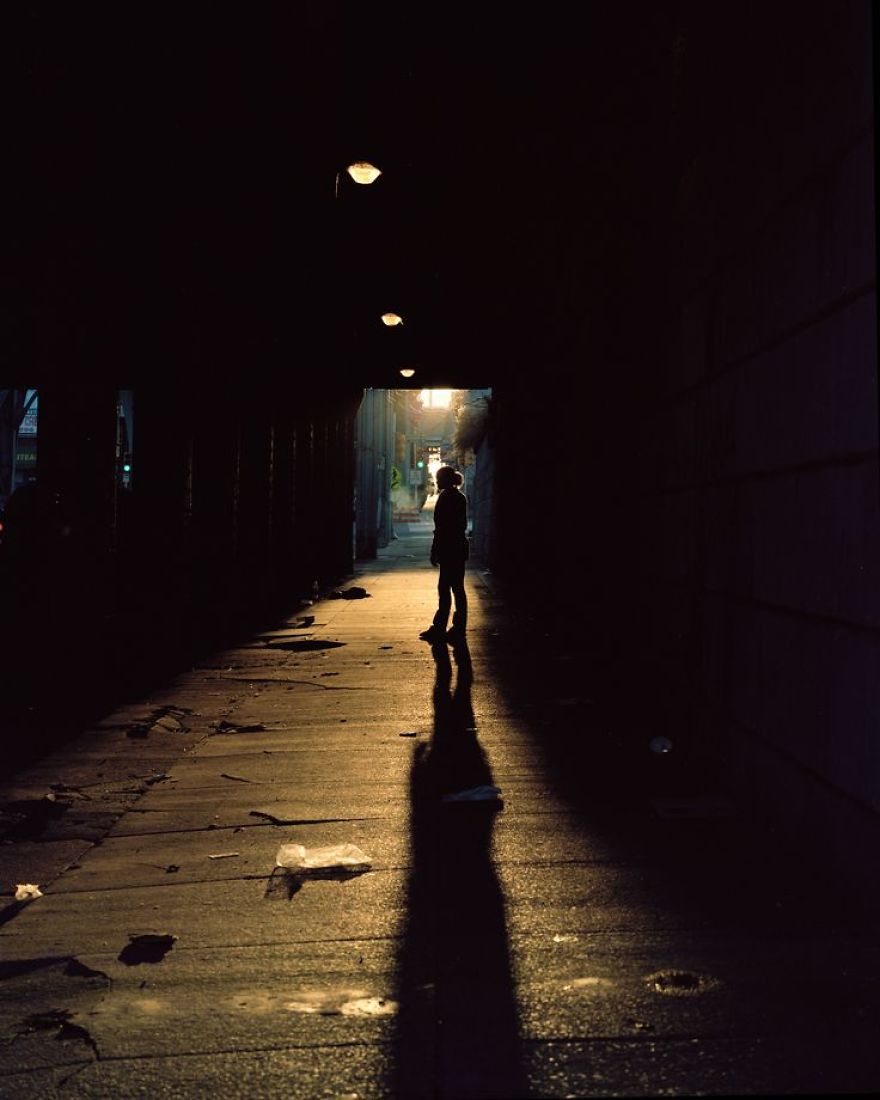 Photography of Jamie posing in dark tunnel