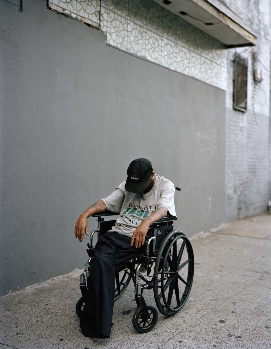 Photography of a man sitting in wheelchair