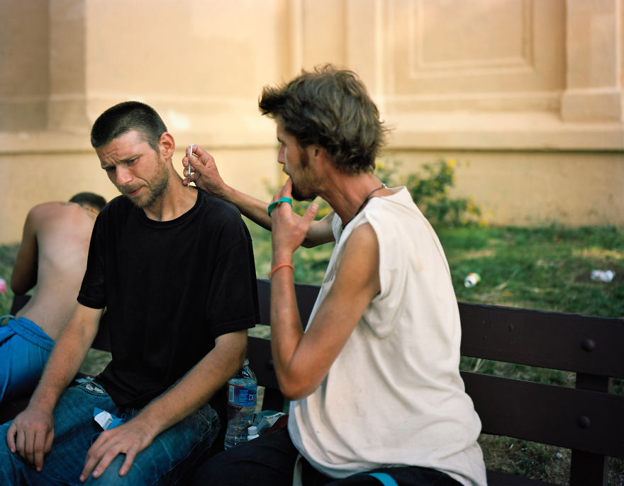 Photography of Matt shoots Brian in the neck in front of the McPherson Square Library on Kensington Avenue