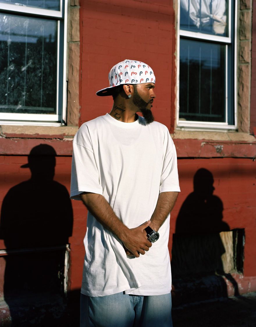 Portrait of Alex near concrete building