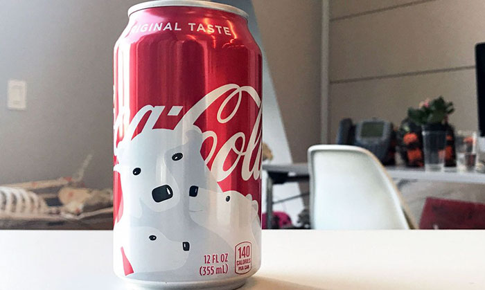 Coca-Cola's Holiday Cans Contain Hidden Designs, And You'll Smile When You Notice Them Coca-Cola's Holiday Cans Contain Hidden Designs, And You'll Smile When You Notice Them