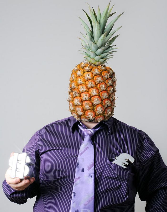 Businessman in purple shirt and pineapple head