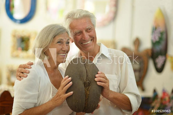 Happy older couple are holding elephant b**t replica
