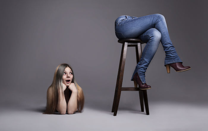 A woman is checking out her a*s which has been cut off from the rest of her body