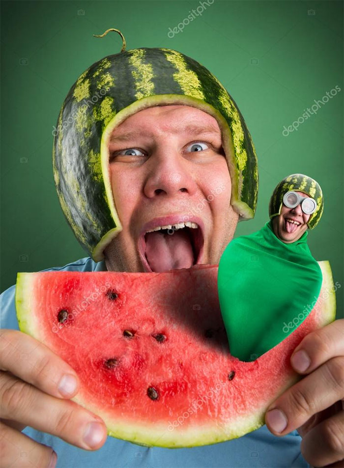 A man with a watermelon hat eating watermelon and a smaller guy comes out of the watermelon