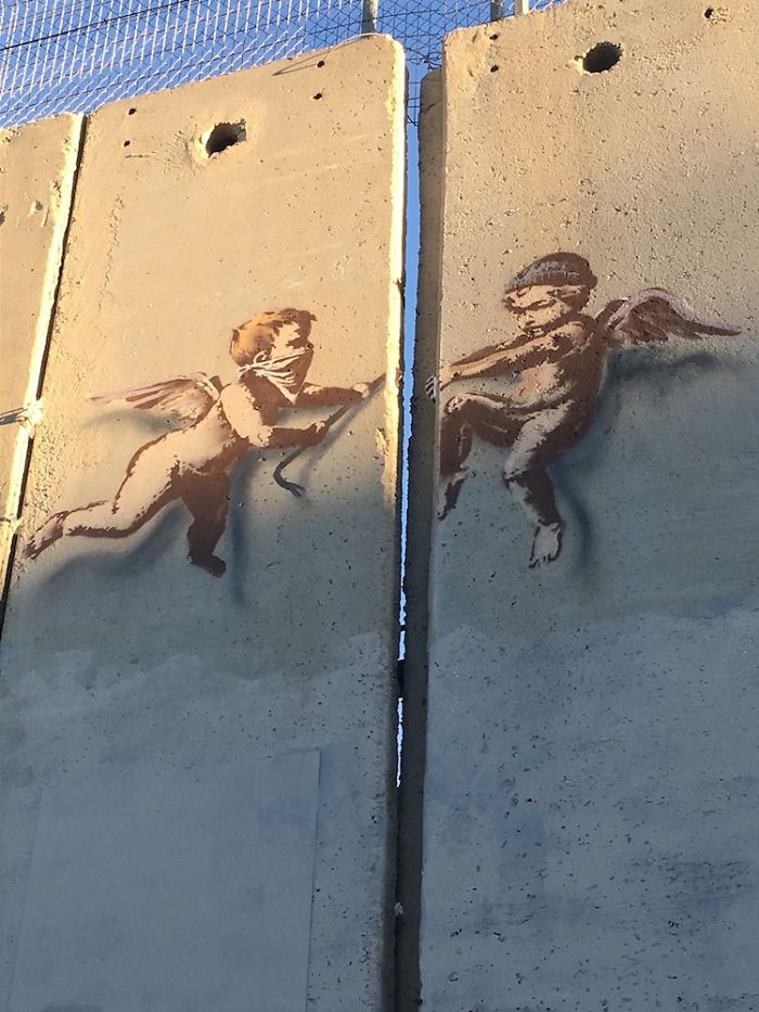New Banksy Street Art In Palestine Reminds World That The Holidays Aren't Happy For Everyone New Banksy Street Art In Palestine Reminds World That The Holidays Aren't Happy For Everyone