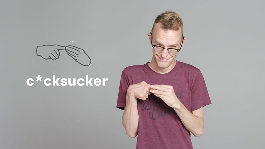 Person demonstrating curse words in sign language, wearing glasses and a maroon shirt, with a graphic of the sign next to them.