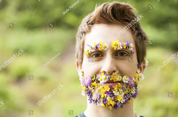 A man has flowers instead of a beard