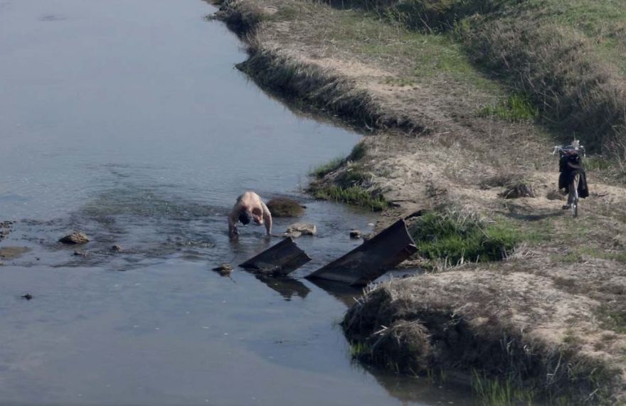 A man bathing in the river 
