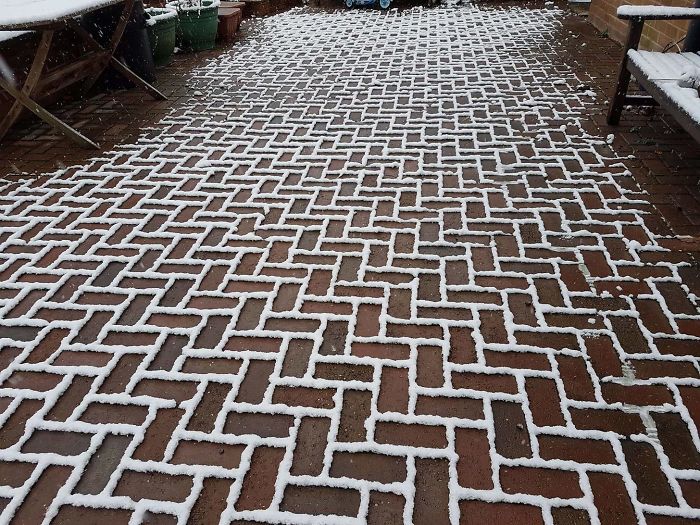 The Snow Has Settled Only On The Outline Of The Bricks On My Friends Driveway