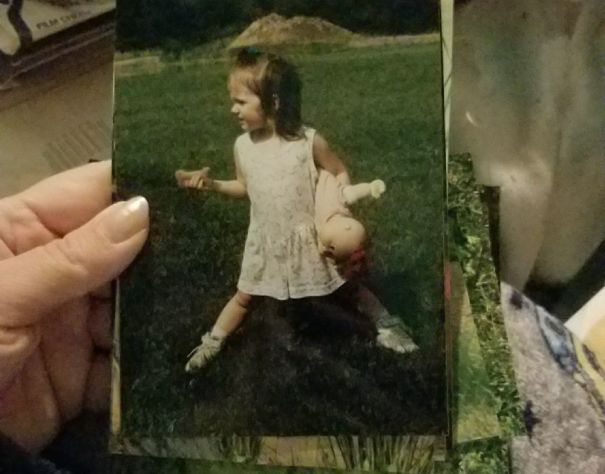 Yes, That Is A Dog Biscuit In One Hand, And A Cabbage Patch Dolly In The Other.